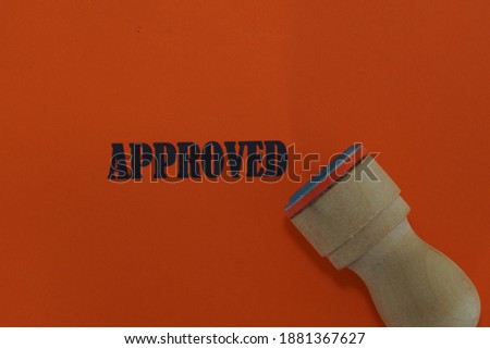 APPROVED word with rubber stamp