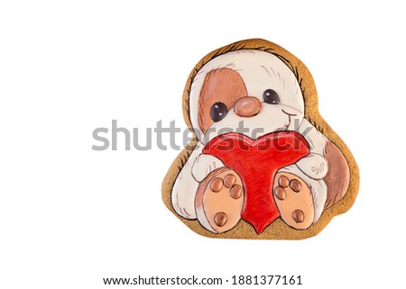 Gingerbread shaped as sloth with big red heart in his arms, ginger cookies, isolated on a white background