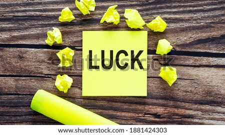 Notes about LUCK ,concept on yellow stickers on wooden background