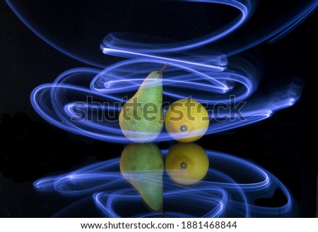 Fruits illuminated with light painting