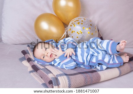 Kids birthday with balloons. Newborn baby one month old. Happy birthday