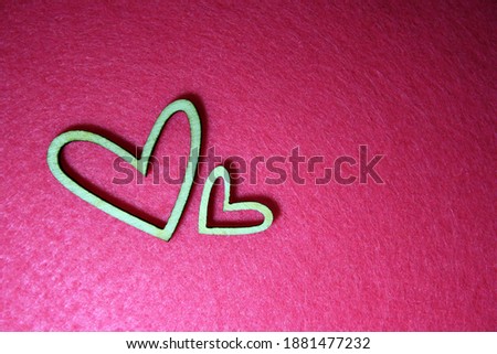 Valentine's day background with wooden heart. Pink background.