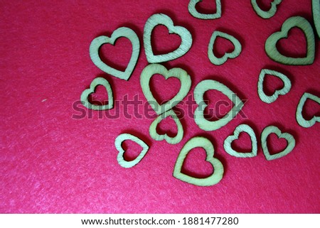 Valentine's day background with wooden heart. Pink background.