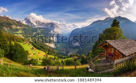 Panorama of Lauterbrunnen valley located in the Swiss Alps near Interlaken in the Bernese Oberland of Switzerland, also known as the Valley of waterfalls. Viewed from the alpine village of Wengen. Royalty-Free Stock Photo #1881489394