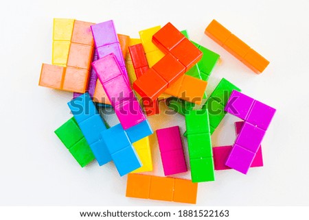 Colorful puzzle cubes background, geometric figures, table game, multicolored