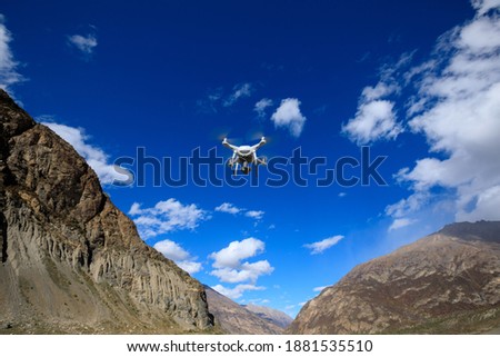 Flying drone taking picture of high altitude mountains in Tibet,China