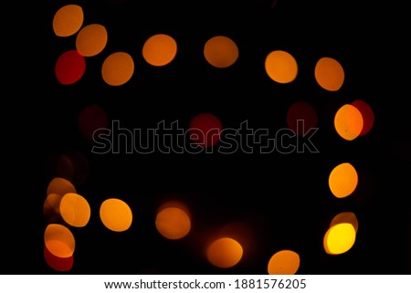 Texture of blurred bokeh colorful lights on black background