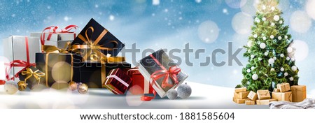Christmas background with gift boxes in snow