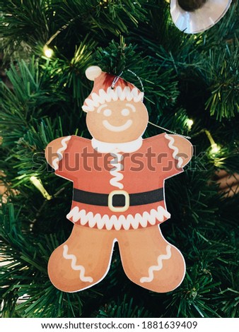 Gingerbread Plush hanging on Christmas tree. Christmas Decoration. Holiday Decoration. Festive. Happy Holiday. Party Decor. 