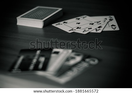 Playing cards are laid out on the table, pictures up and pictures down