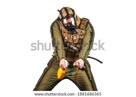 Covid-19 (coronavirus) sanitizer man parody portrait. Guy wears special military suit, army gear and full face gas mask. Yellow spray bottle in his hands. Isolated, white background.