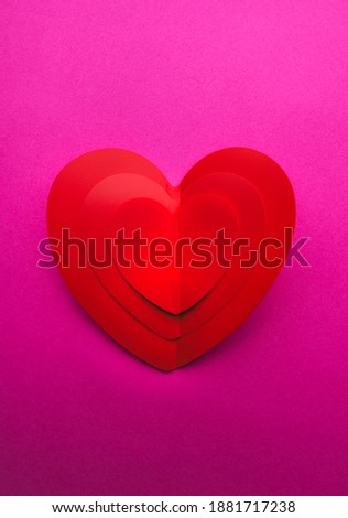 Background with one paper heart origami, Valentine greeting card or Happy Valentine's Day, love concept. Handcrafted designed card expressing love.