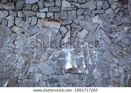 in the photo a wall of stones. wonderful background