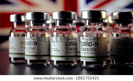 Covid Vaccine Bottles with the UK Flag in the Background Corona Vaccine Bottles in front of a UK Flag Royalty-Free Stock Photo #1881735421
