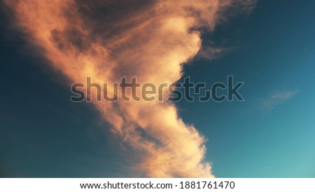 orange clouds in the drack blue sky 