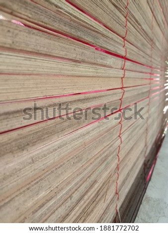 horizontal bamboo blinds in front of the house