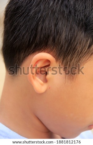 photo of the right ear of the boy