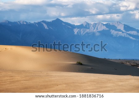 Chara sands against the background of the Transbaikal ridge Royalty-Free Stock Photo #1881836716