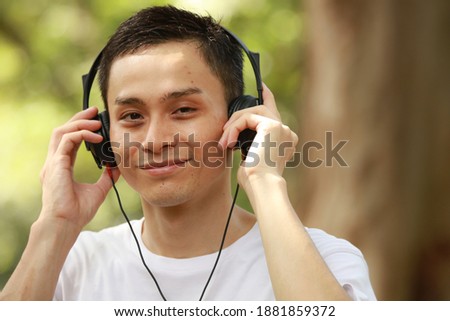 Image of a man listening to music
