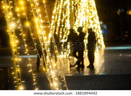
Christmas lights. Tree of bright yellow lights