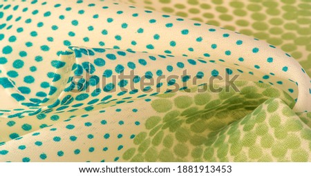 silk fabric. Blue and green pattern with polka dots on a beige background. Texture. for web design, desktop wallpaper, winter blog, website or invitation card.