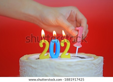 new year cake with the 2021 candles burning
