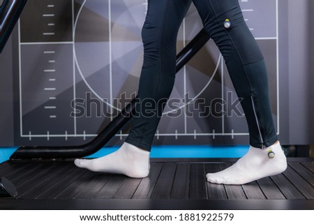 Gait or walking speed biometric analysis on a treadmill Royalty-Free Stock Photo #1881922579