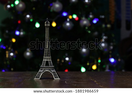 A little Eiffel tower model with beautiful bokeh background