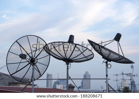 satellites dishes antenna on roof top among the city
