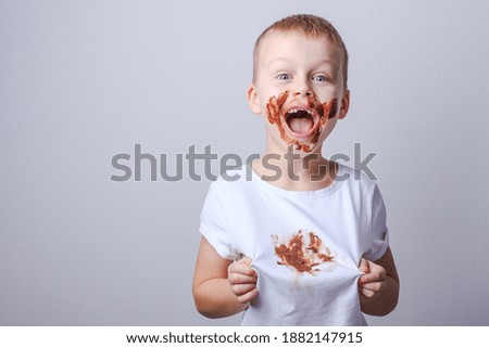 chocolate stain on white baby clothes
 Royalty-Free Stock Photo #1882147915