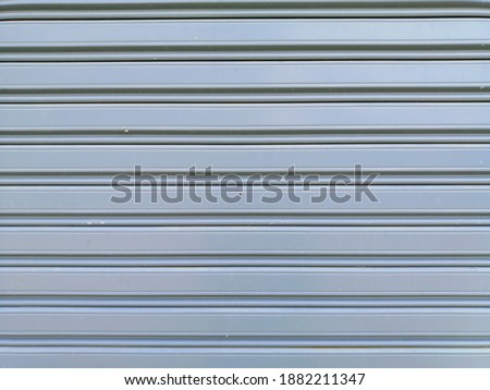 Gray metal sheet with parallel line from left to right