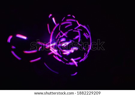 beautiful blue red pink light rays light painting energy alike scrambled rotate parallel glowing long exposure