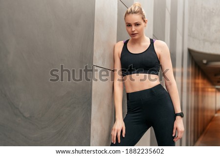 Black clothing for sports, Woman in sports tops, Girl at the wal