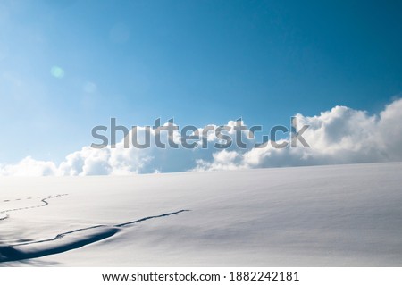 Snow hills and blue sky
