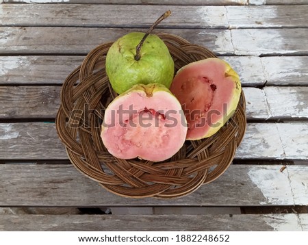 Red guava on a wooden table.