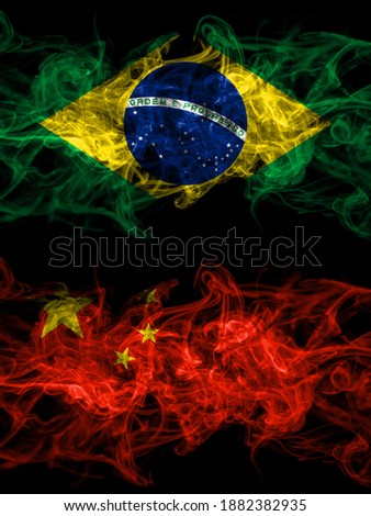 Brazil, Brazilian vs China, Chinese smoky mystic flags placed side by side. Thick colored silky abstract smoke flags.