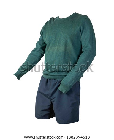 knitted green sweater and dark blue shorts isolated on white background. fashionable clothes for every day