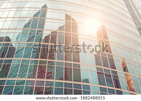 Reflection of modern skyscrapers lit by sun, Moscow city towers overall view