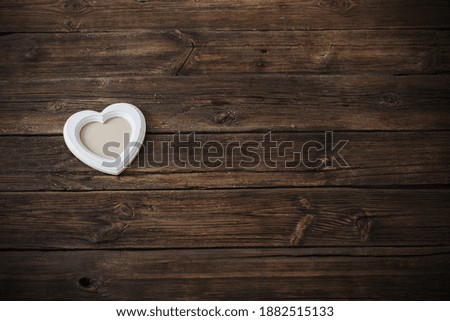 old white wooden frame on wooden table