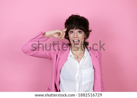 Young business woman over isolated pink background smiling and thinking with her fingers on her head that she has an idea.