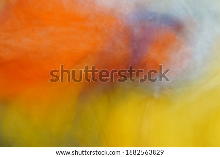 An Abstract Photo of a Tornado Showing the Fall of Rain Funnels on a Colourful Motion Background.