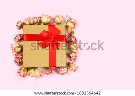 Concept for Valentine's Day or Women's Day. Postcard, hearts and flowers in gift boxes on a pink background, place for text, banner, Happy holidays, congratulations, birthday,