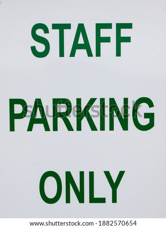 Staff Parking Only sign - green letters.