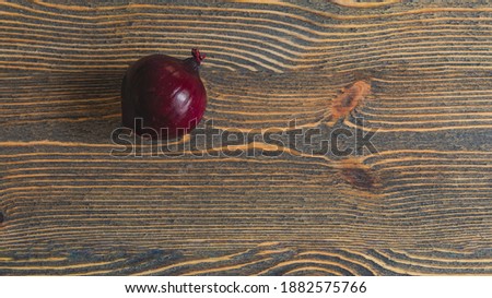 Red onion on wooden boards