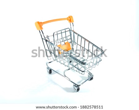 Selective focus.Shopping trolley isolated on white background.