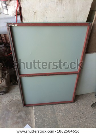 Blank signboard frame  at a paint shop