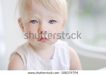 Adorable toddler girl portrait at summer