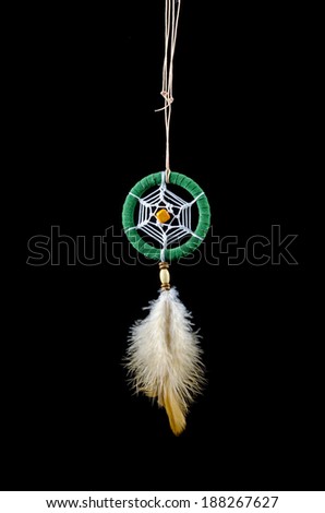 Beautiful green dream catcher on black background with clipping path