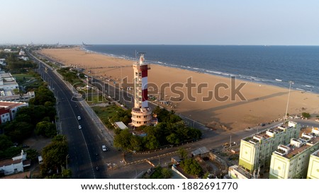 The Chennai Lighthouse formerly the Madras Lighthouse, is a lighthouse facing the Bay of Bengal on the east coast of the Indian Subcontinent. It is a famous landmark on the Marina Beach in Chennai, Royalty-Free Stock Photo #1882691770