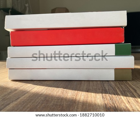 Empty cover laid up books. white and red books without titles or writings.  